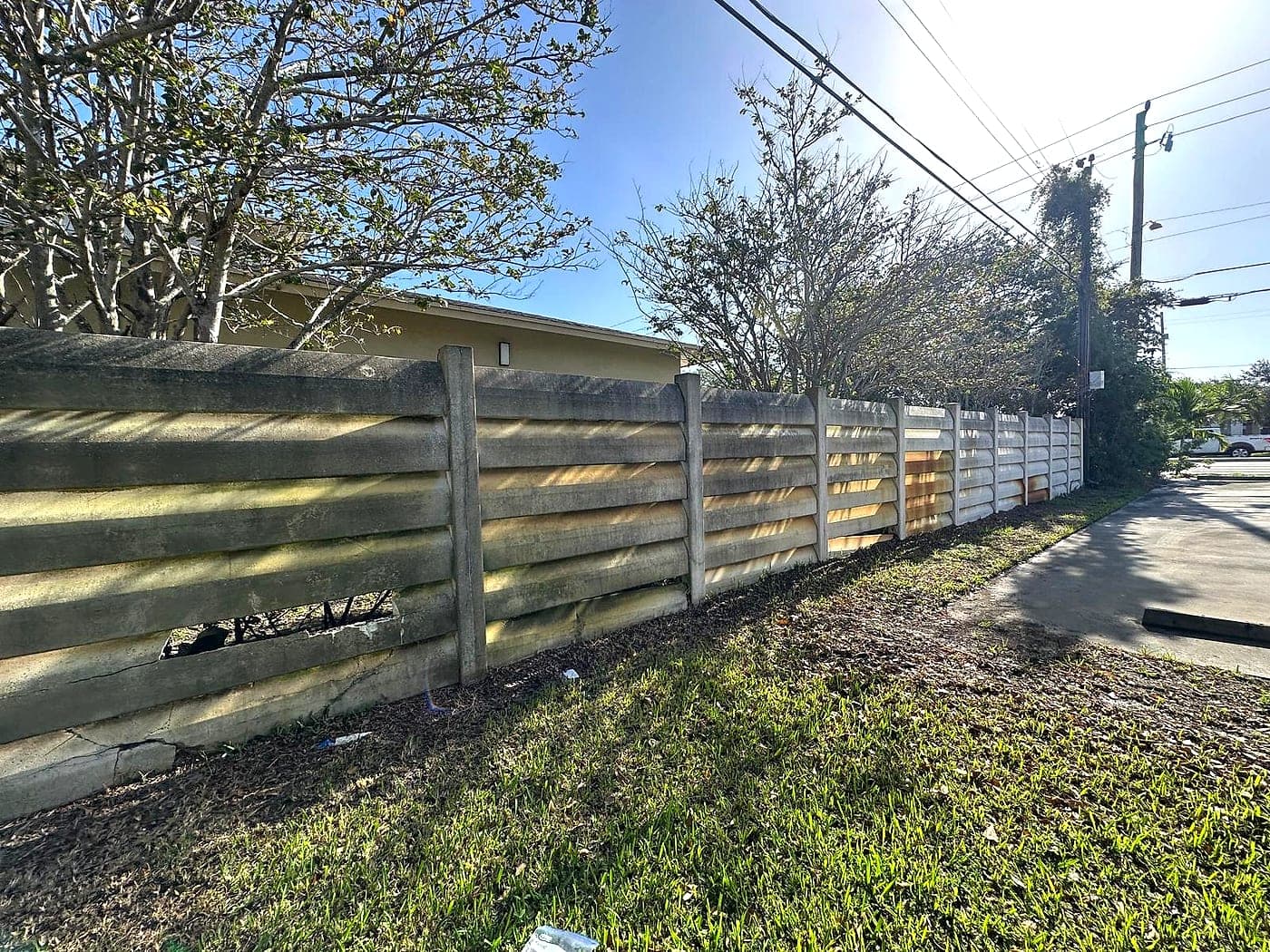 Long wall wash, pressure washing by Off The Muscle in Palm Beach County